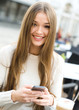 Text Messaging.  Looking at camera