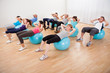 Class of diverse people doing pilates