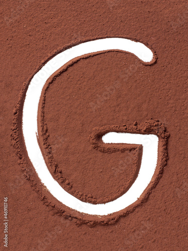 Photo: Letter G made of cocoa powder Letter G made of cocoa powder