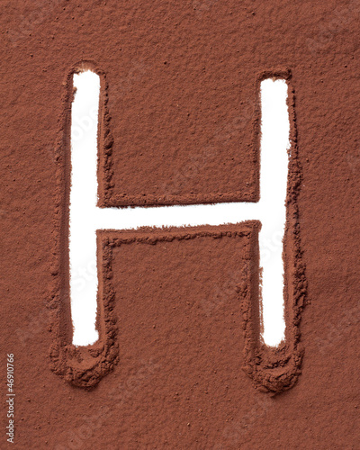 Photo: Letter H made of cocoa powder Letter H made of cocoa powder