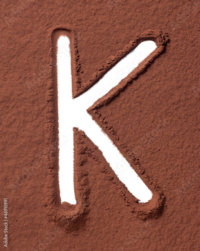 Photo: Letter K made of cocoa powder Letter K made of cocoa powder