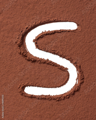 Photo: Letter S made of cocoa powder Letter S made of cocoa powder