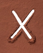 Letter X made of cocoa powder