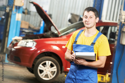 Photo: Repairman auto mechanic inspector Repairman auto mechanic inspector