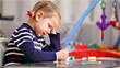 Little girl painting in concentration