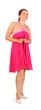 Beautiful woman wearing pink dress smiles in studio on white