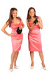 Two same women wearing pink evening dress in studio on white