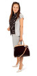 Beautiful business woman wearing in suit holds bag in studio