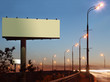 Foto: Road with lanterns and large blank billboard at evening in city. Road with lanterns and large blank billboard at evening in city.