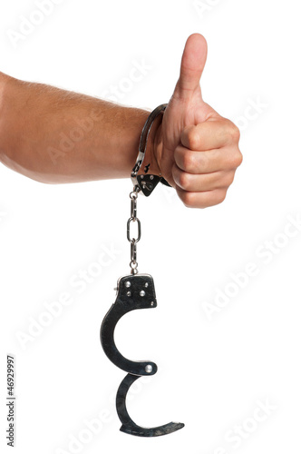 Photo: Hand with handcuffs Hand with handcuffs