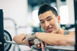 Photo: Young man having a rest in the gym. Young man having a rest in the gym.