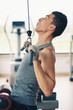 Young man training in the gym.