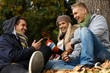 Photo: Happy companionship in autumn park Happy companionship in autumn park