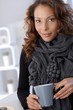 Portrait of attractive female drinking tea