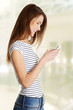 Happy caucasian teen with a mobile.