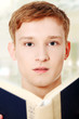 Photo: Young man is reading a book Young man is reading a book