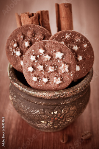 Photo: Chocolate Christmas cookies and cinnamon sticks Chocolate Christmas cookies and cinnamon sticks