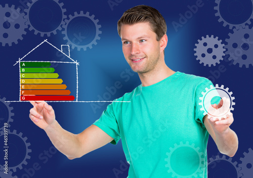 Photo: junger mann mit energiediagramm junger mann mit energiediagramm