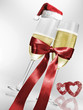 Foto: Sektgläser in roter Schleife mit Weihnachtsmütze Herz Sektgläser in roter Schleife mit Weihnachtsmütze Herz