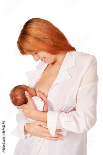 Photo: Beautiful red-haired mom and baby. Isolated on white Beautiful red-haired mom and baby. Isolated on white