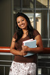 Young Eastern Student holding Books in College Campus