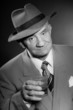 Senior vintage man wearing hat. Black and white shot. Gangster.