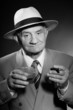 Senior vintage man wearing hat. Black and white shot. Gangster.