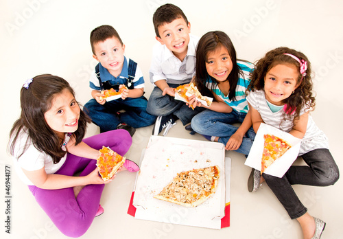 Photo: Group of kids eating pizza Group of kids eating pizza