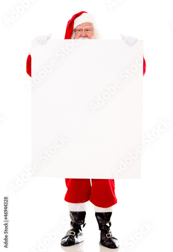 Photo: Santa Claus holding a banner Santa Claus holding a banner
