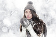 Photo: Beautiful young brunette woman heating hands Beautiful young brunette woman heating hands