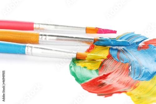 Photo: Abstract gouache paint and brushes, isolated on white Abstract gouache paint and brushes, isolated on white
