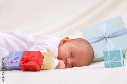 Photo: Baby Sleeping By Gift Boxes Baby Sleeping By Gift Boxes