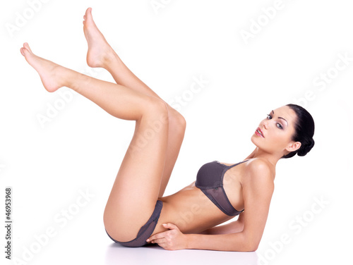 Photo: beautiful woman with raised up long legs beautiful woman with raised up long legs