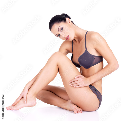 Photo: Woman with beautiful legs in bikini Woman with beautiful legs in bikini