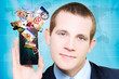 Photo: Business Man Steaming Media Apps On Smart Phone Business Man Steaming Media Apps On Smart Phone