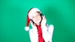 Little girl Santa listening to music
