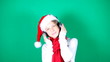 Little girl Santa listening to music