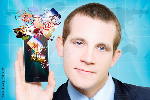 Photo: Business Man Steaming Media Apps On Smart Phone Business Man Steaming Media Apps On Smart Phone