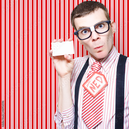 Photo: Nerdy 60s Salesman Holding Business Card Nerdy 60s Salesman Holding Business Card