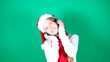 Little girl Santa listening to music