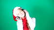 Little girl Santa listening to music