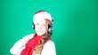 Little girl Santa listening to music