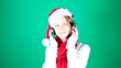 Little girl Santa listening to music