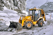 clearing roads of snow and fallen tree