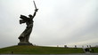 Mamaev Burial. People comes to statue of Motherland
