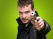 Portrait Of A Man Holding Gun