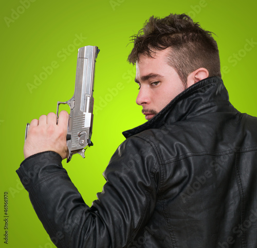 Photo: Portrait Of A Man Holding Gun Portrait Of A Man Holding Gun