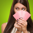 Pretty Young Woman Holding Playing Cards
