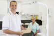 A male dentist and female nurse in a dental surgery