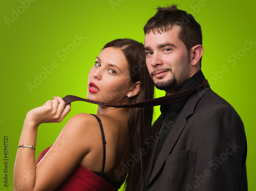 Photo: Beautiful Woman Holding Businessman Tie Beautiful Woman Holding Businessman Tie